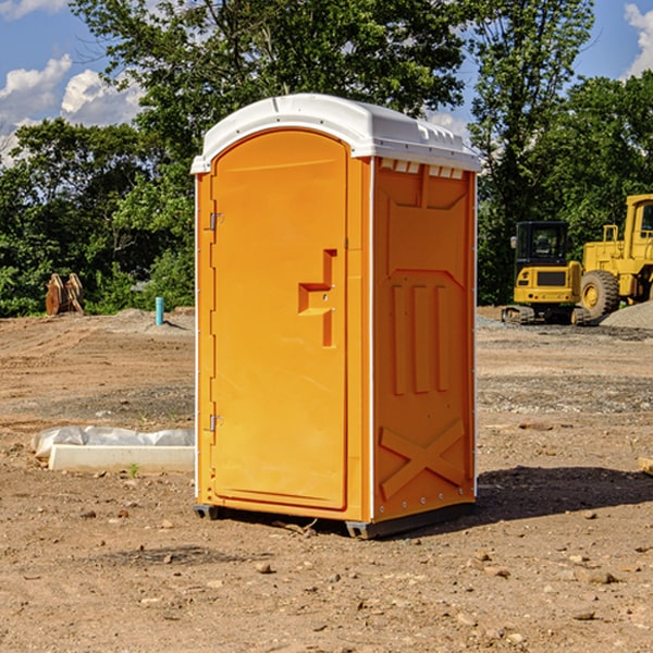 what is the cost difference between standard and deluxe portable toilet rentals in Gun Plain